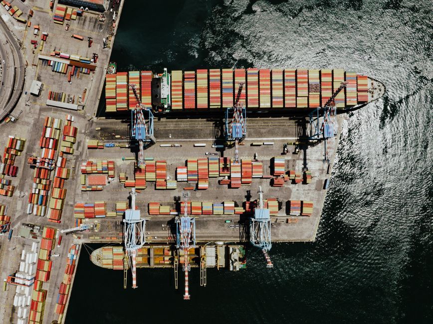 cargo ship logistics container port aerial view