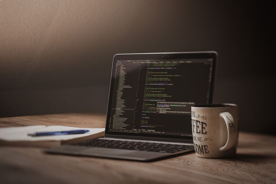 software developer writing code office desk