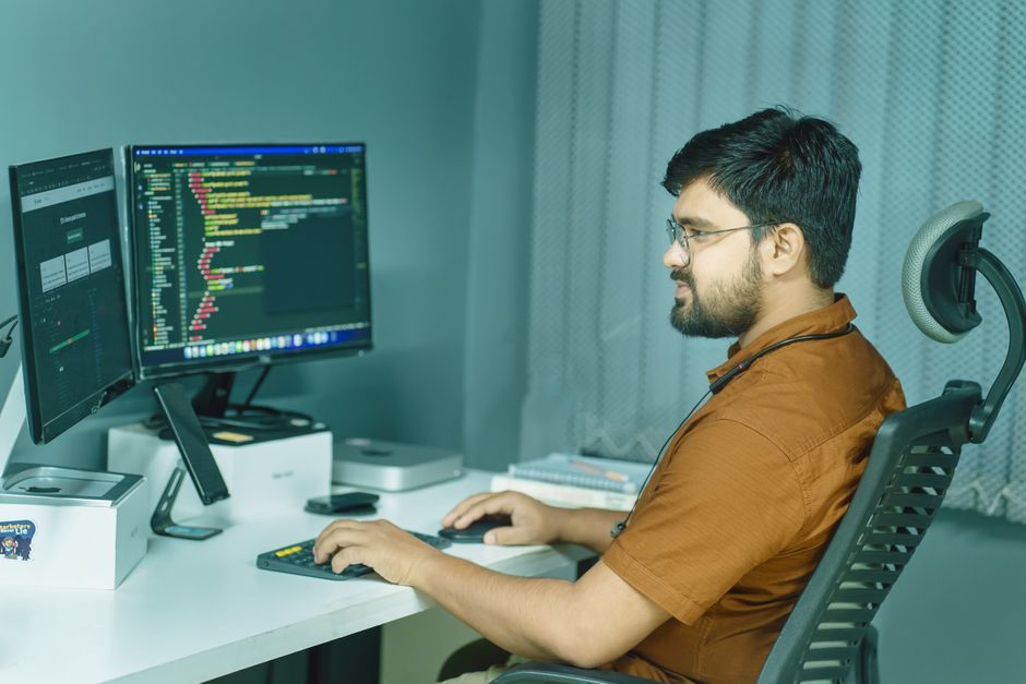 software engineer workspace office desk dual monitors code