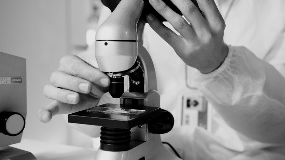 medical researcher laboratory microscope