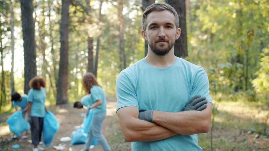politician volunteering cleaning outdoor