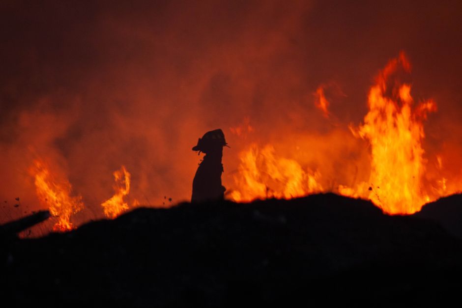 firefighters battling wildfire flames