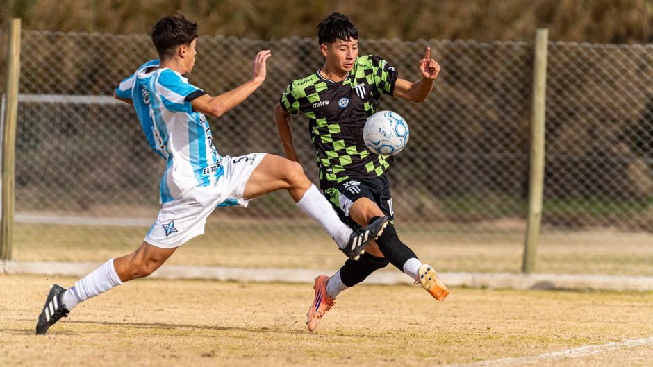 football players on pitch match action