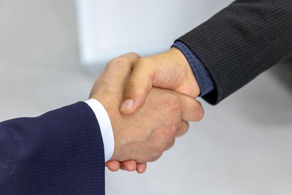 defense ministers handshake meeting