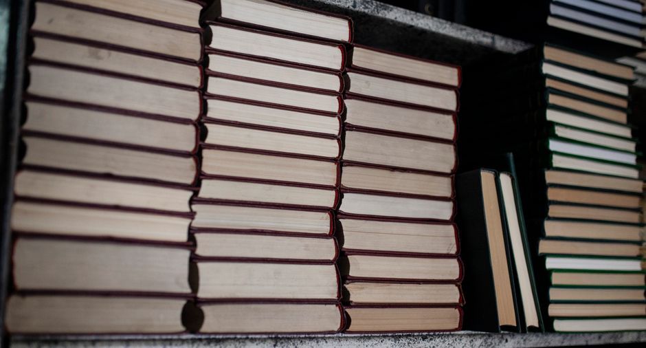 stack of books on a shelf travel relaxation