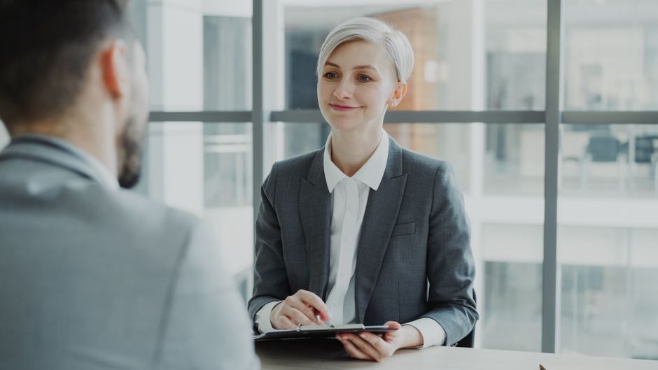 job applicant practicing interview speech in front of mirror