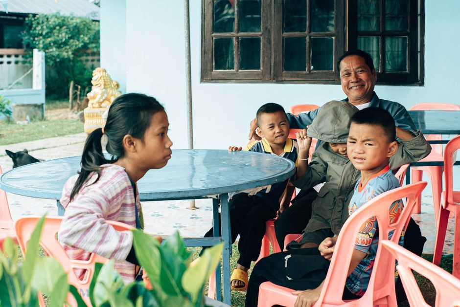 Thai family portrait smiling children countryside Thailand