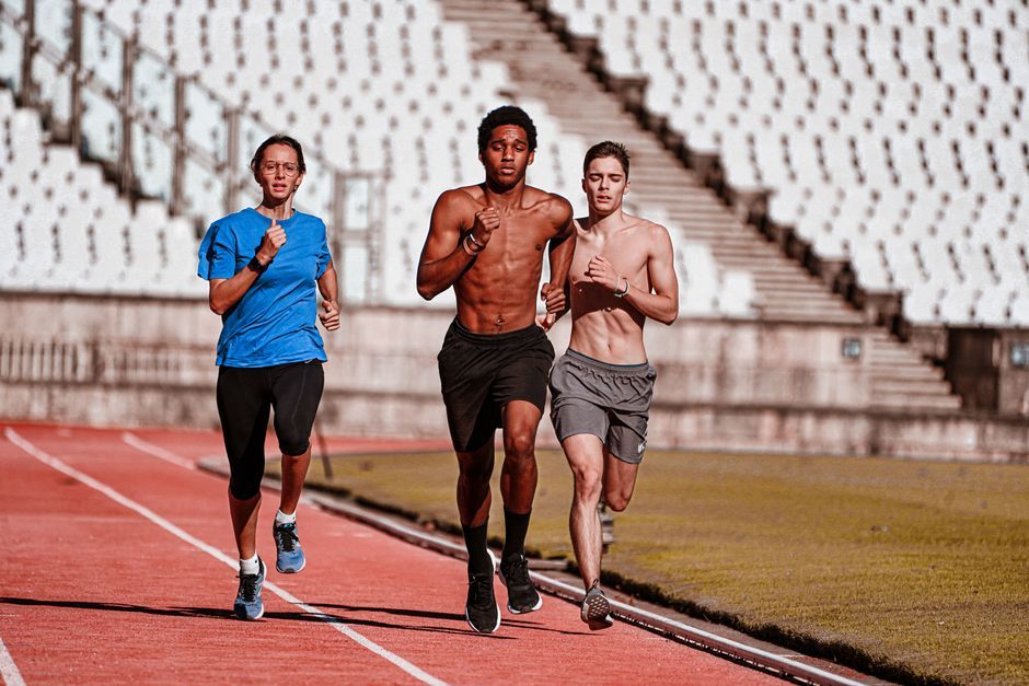 professional female middle distance runner training stadium