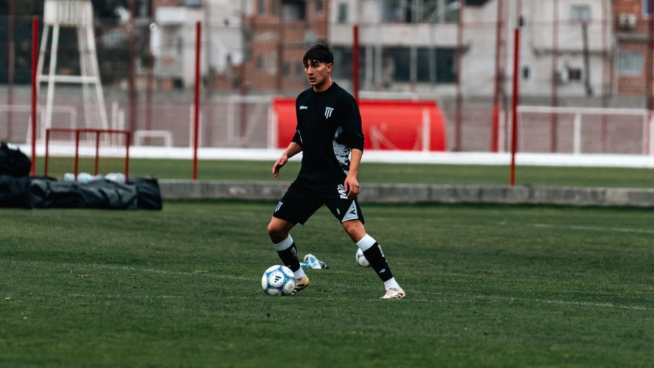 football player action dribbling pitch