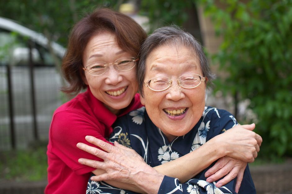 Thailand mother daughter hug smiling
