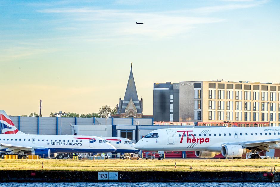 commercial aircraft parked at UK airport runway