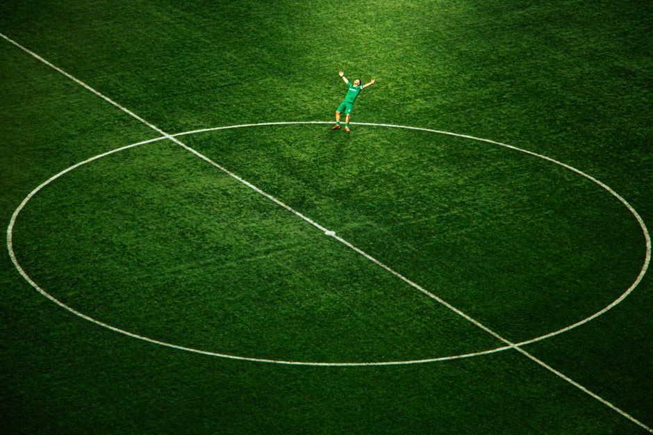 soccer player celebration stadium pitch green grass