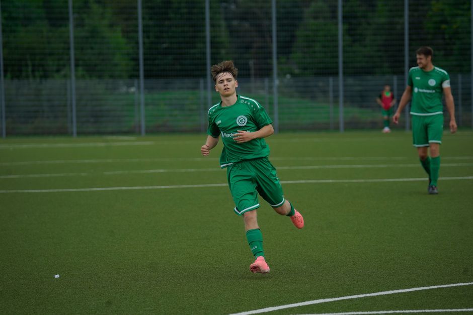 soccer player training ground green pitch