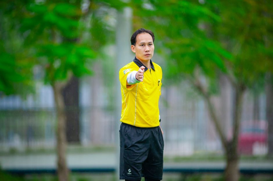 soccer referee whistle match official pitch