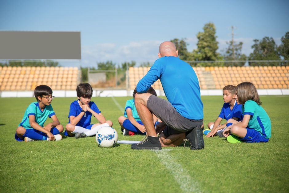 soccer coach tactical board training pitch daytime