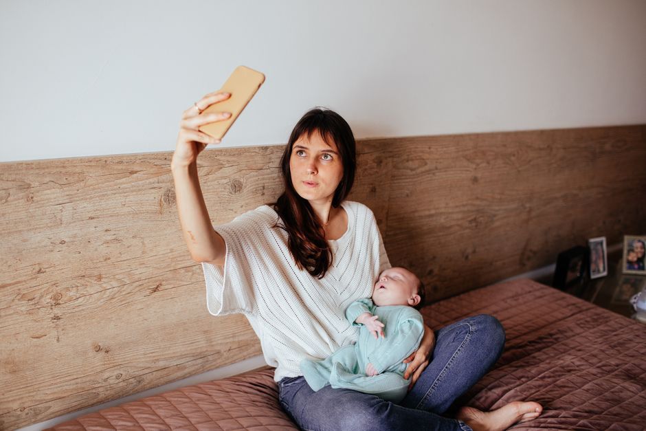 mother holding baby smartphone selfie Thailand
