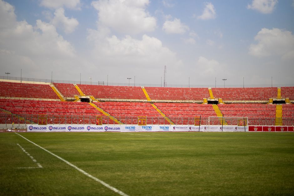 soccer match stadium grass field wide angle no team crest