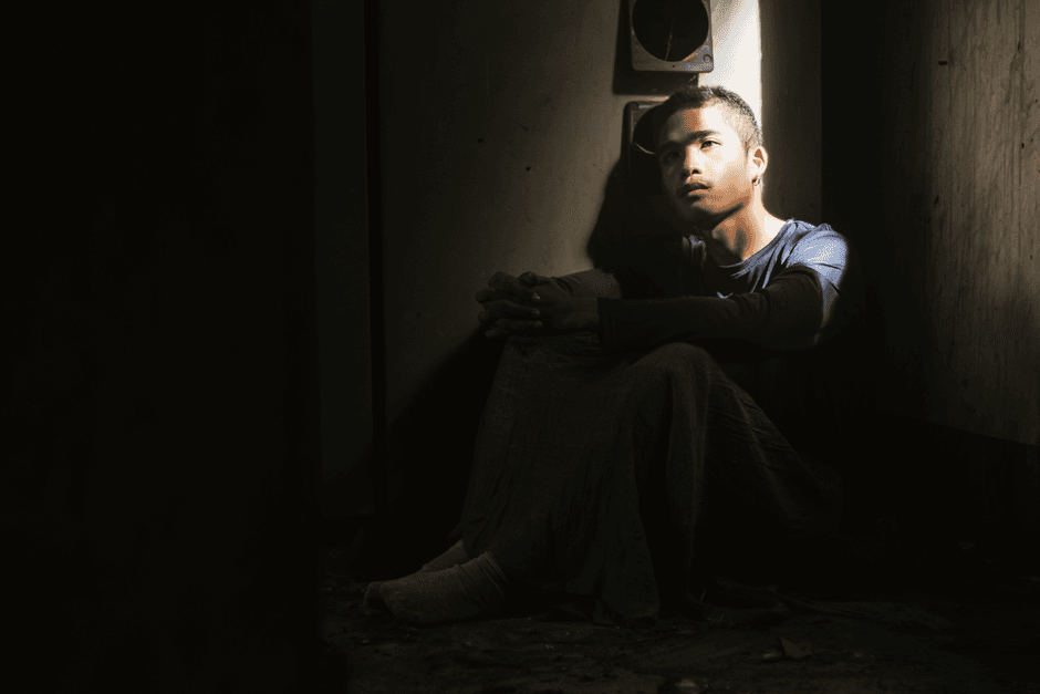 sad lonely person sitting alone room Thailand