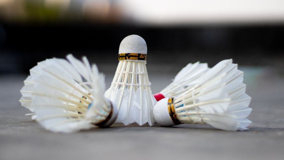 badminton racket shuttlecock indoor court