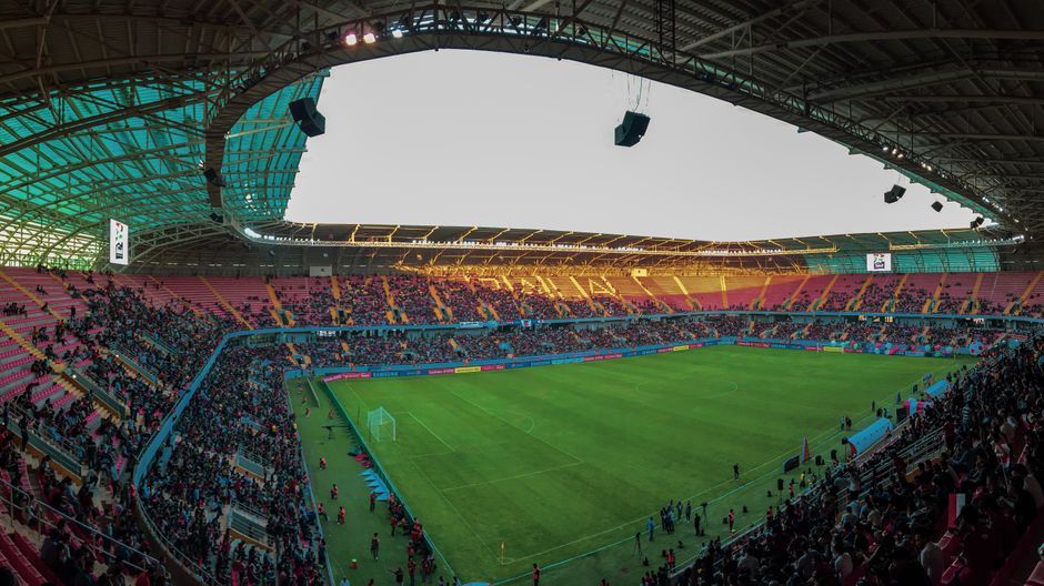 soccer match stadium grass field wide view