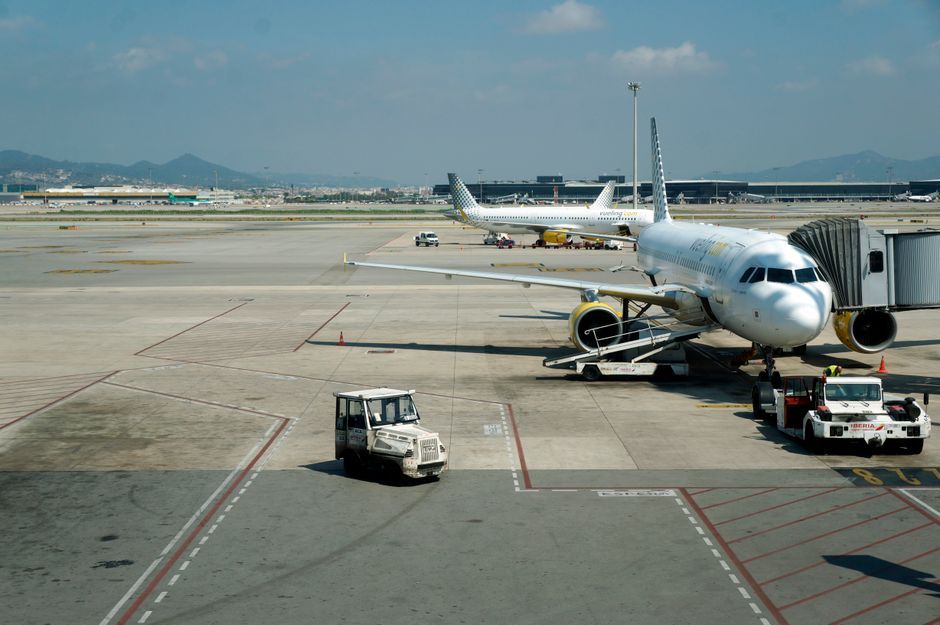 airplane commercial aircraft parked at airport gate