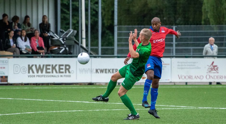 soccer player match action green grass pitch