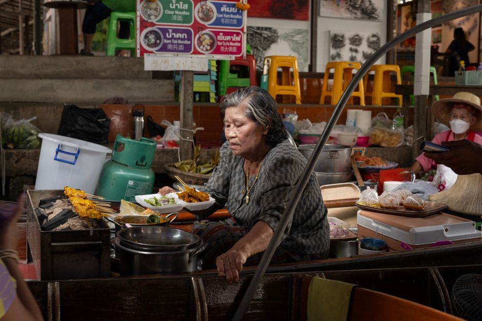 Bangkok flood street vendor makeshift market Thailand