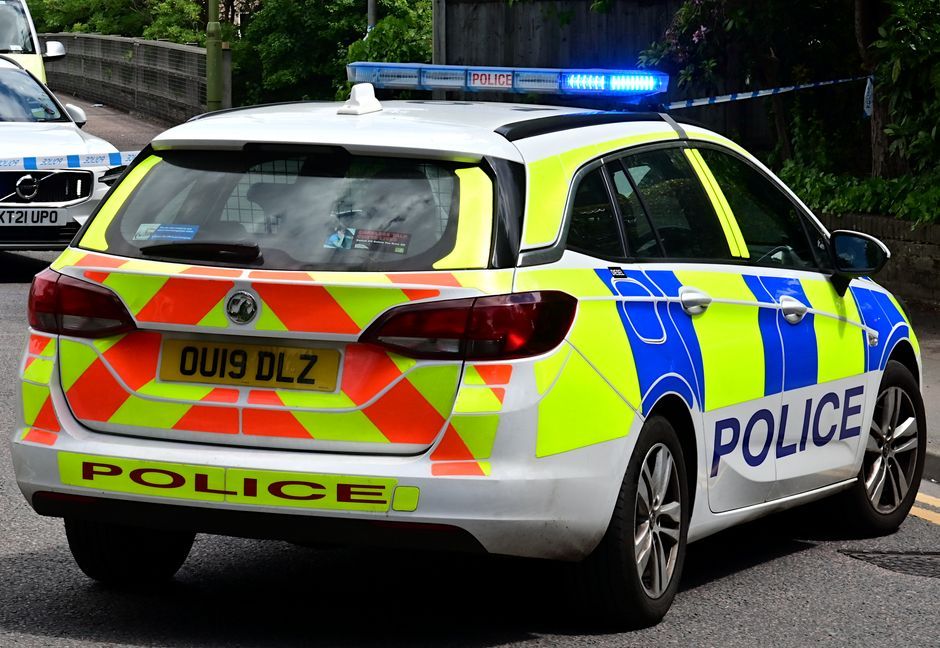 UK police car emergency vehicle road England
