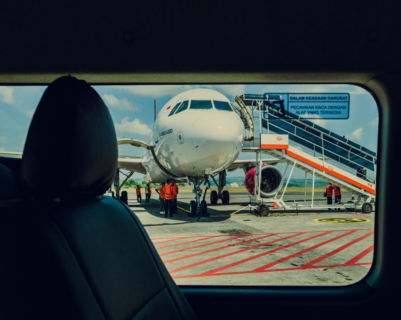 family traveling together airplane airport terminal