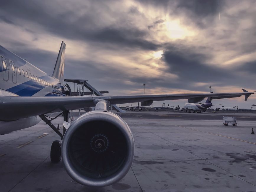 commercial airplane parked at airport gate tarmac India