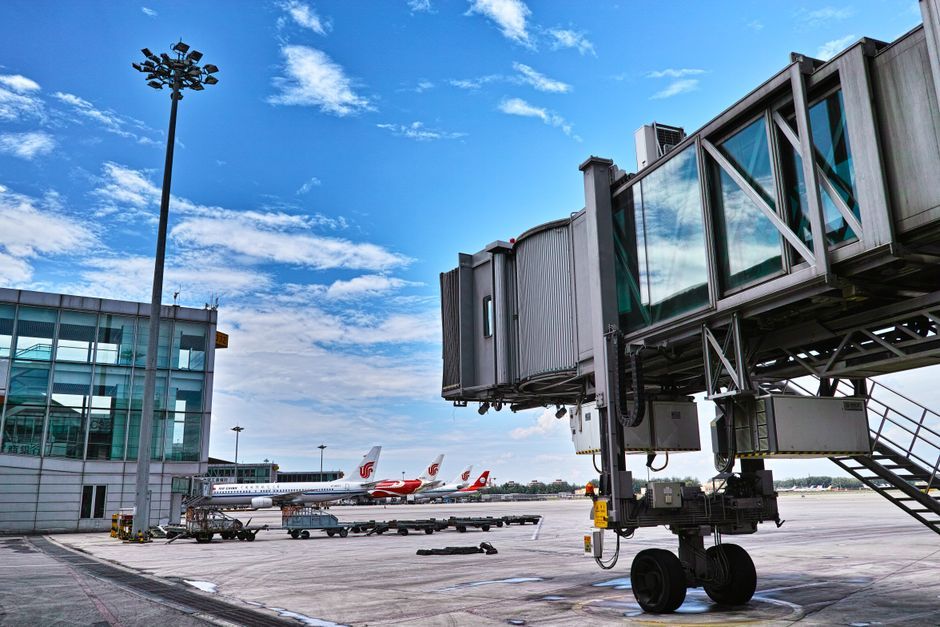 commercial airplane parked at airport gate tarmac India