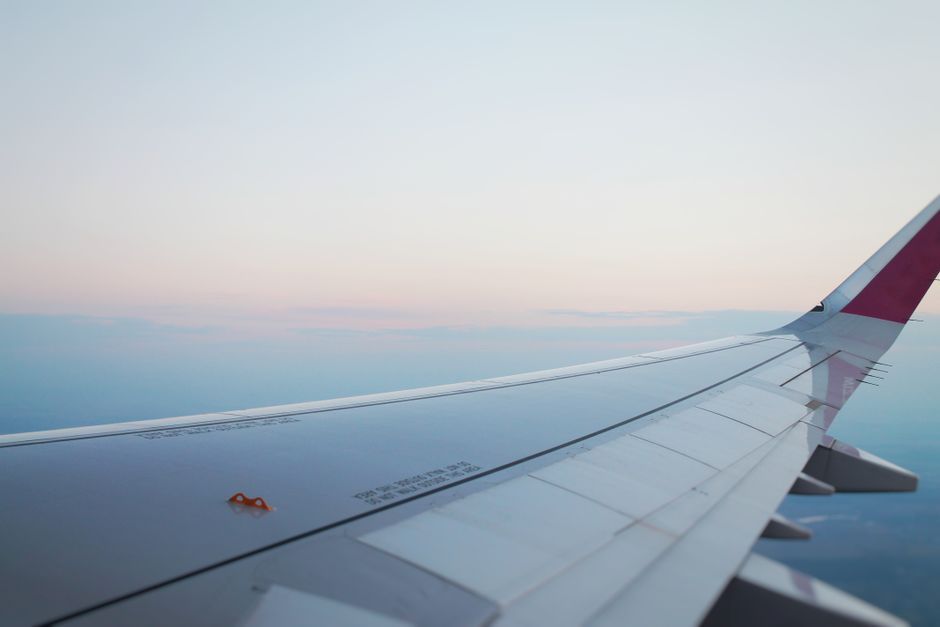 commercial airliner airplane wing view sky