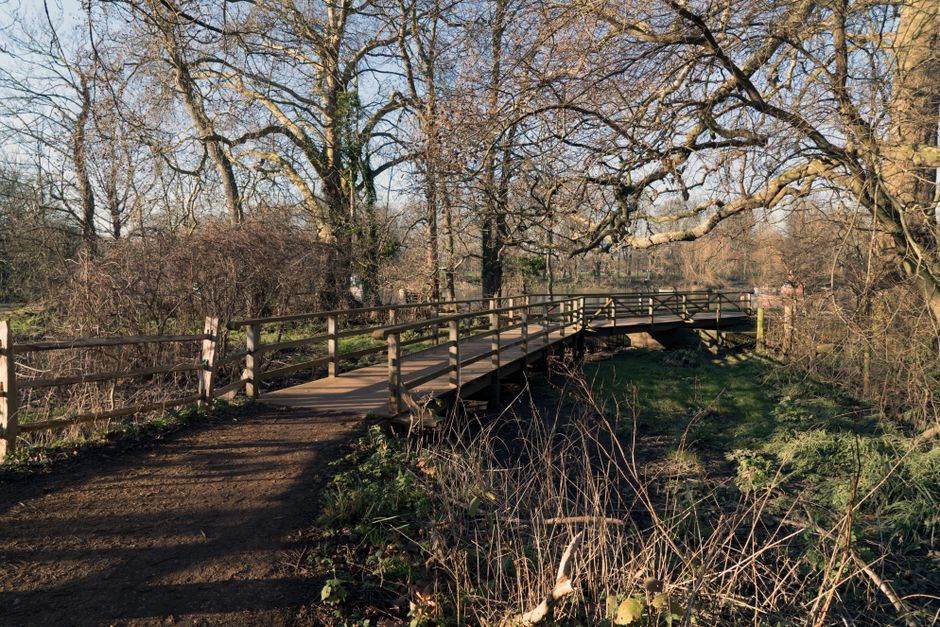 UK countryside dog walking trail river bridge