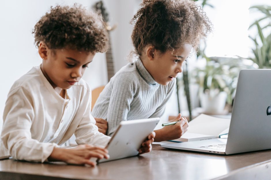 UK school children using digital devices classroom
