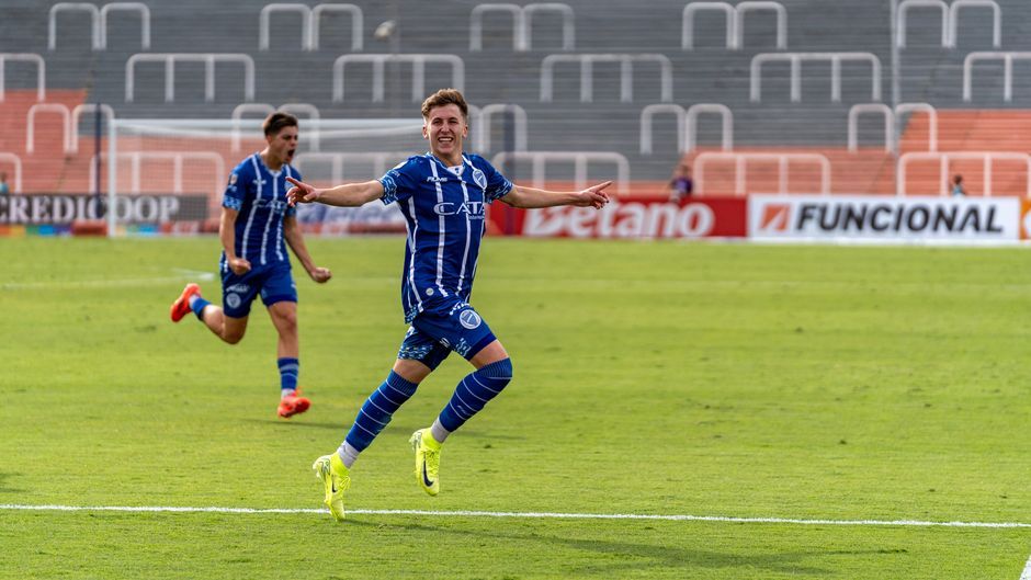 soccer player celebrating goal stadium