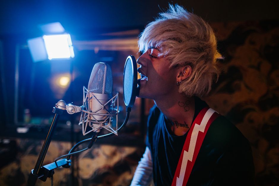 mature Asian male artist singing passionate