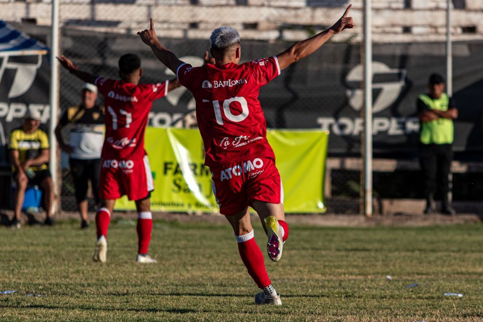 soccer player celebrating goal stadium