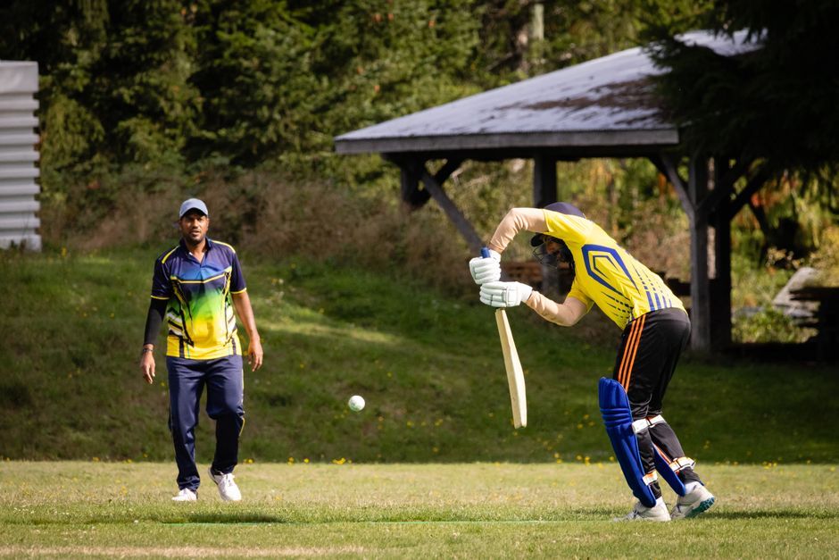 cricket players field match action