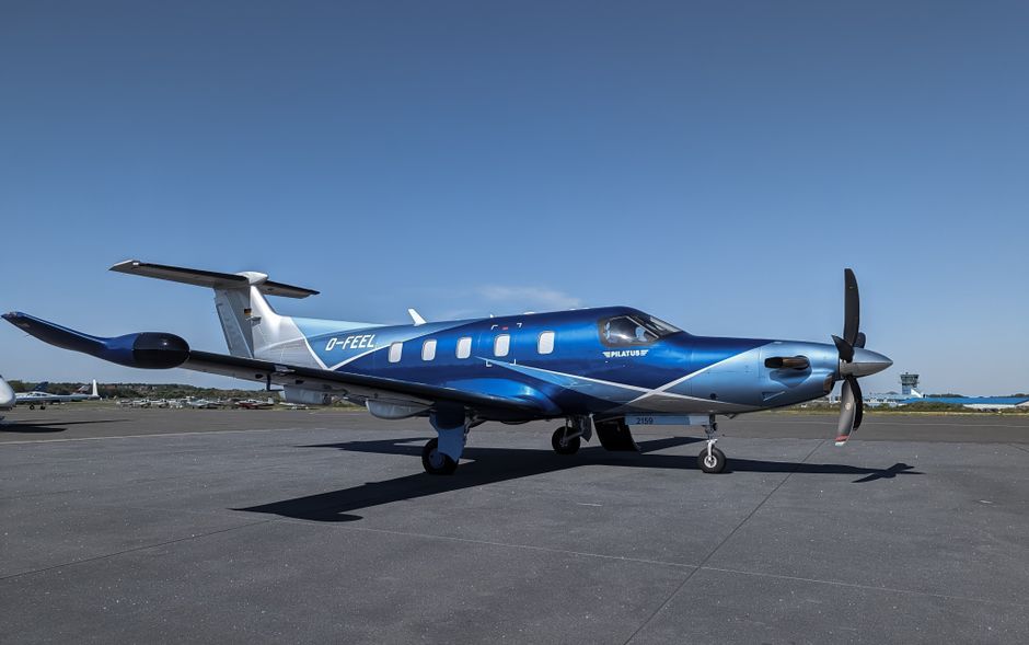 private jet airplane tarmac sunny day
