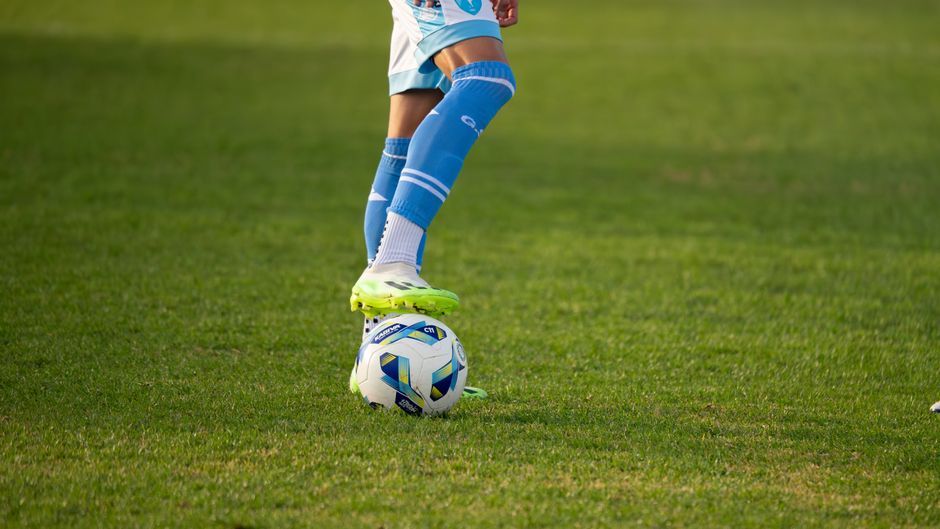 professional football player training ground grass field
