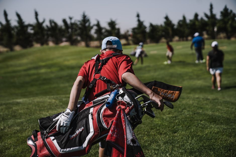 golf clubs bag on golf course fairway