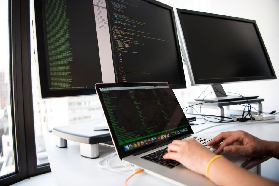 software engineer workplace computer screen code