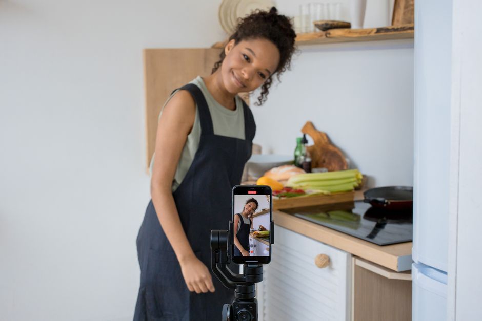 content creator filming travel video smartphone
