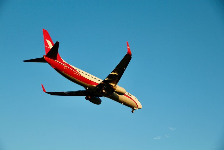 commercial airliner airplane in flight travel