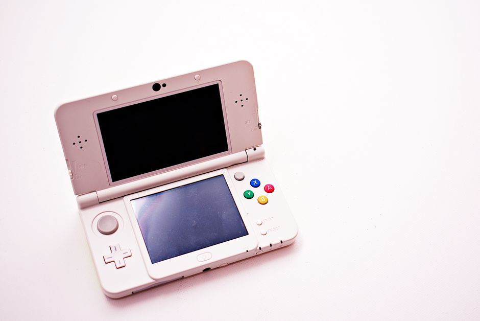 handheld video game console device close up no logo