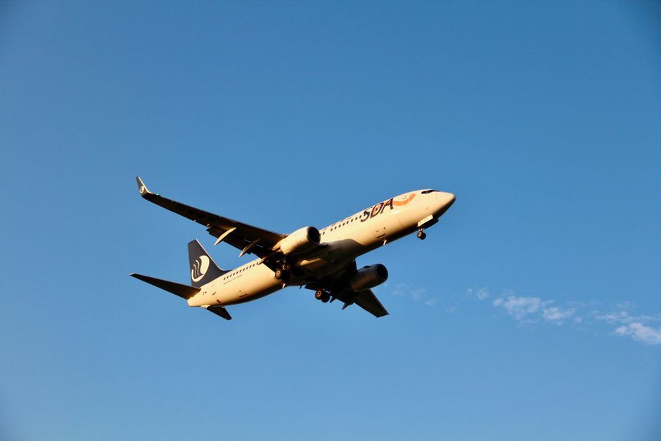 commercial airliner airplane flying sky