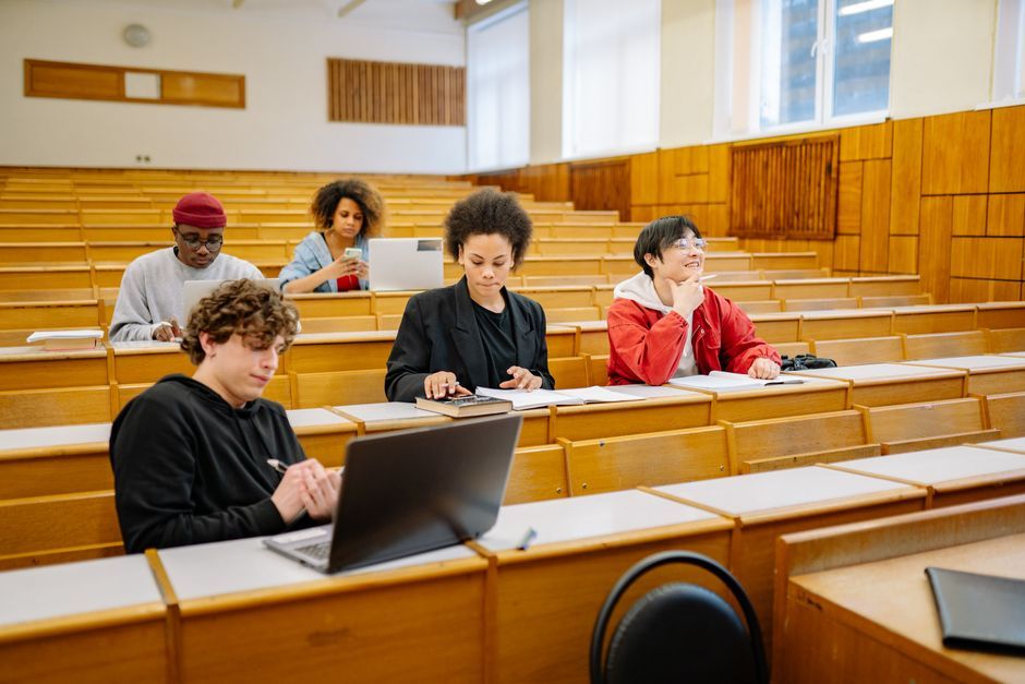student using laptop modern classroom