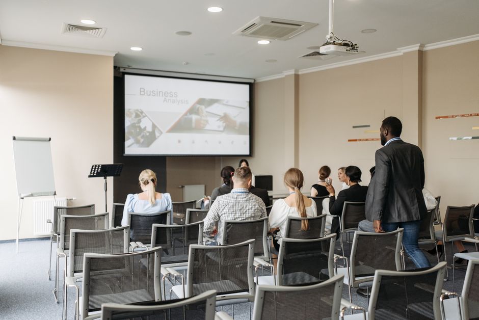 business conference speaker presentation screen daytime