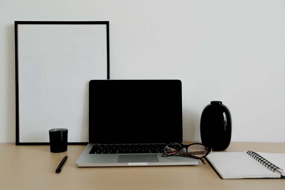 black notebook computer office desk workspace
