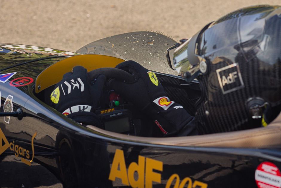 Formula 1 racing car cockpit steering wheel garage